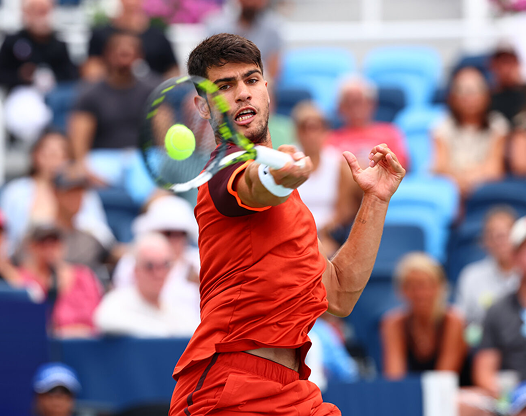 Tennis player hitting a ball